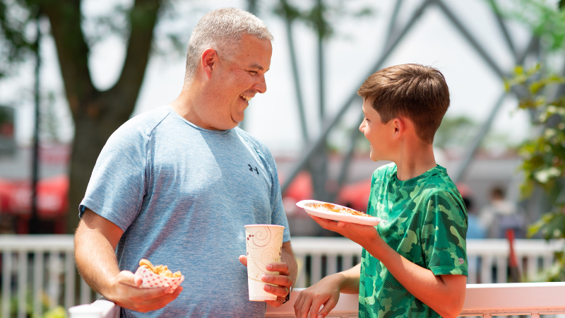 Dad and son enjoying a meal at Castle Park