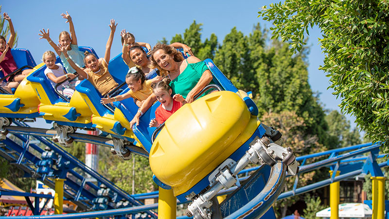 Riders Having Fun and  Laughing On Coaster
