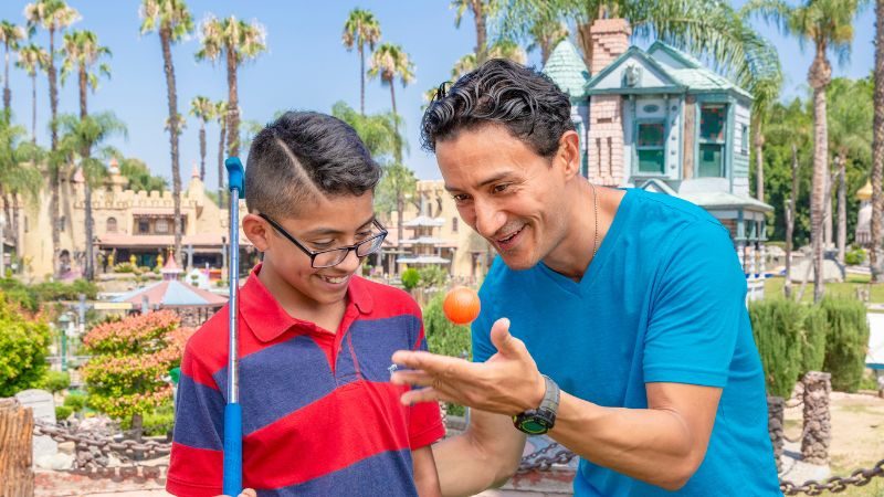 Couple Playing Mini Golf