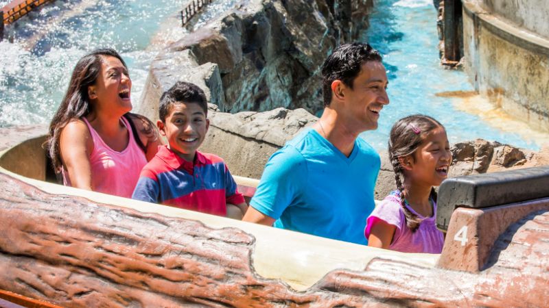 Family on water log ride