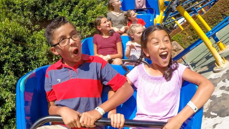 Riders Having Fun and  Laughing On Coaster