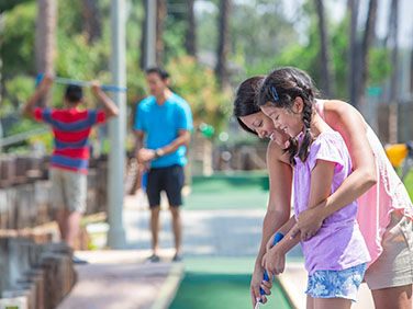 Family enjoying Mini Golf